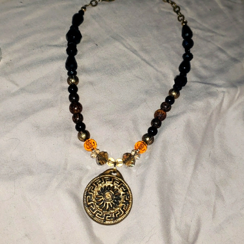 New not used vintage boho glass and brass necklace w/ clay sun pendent